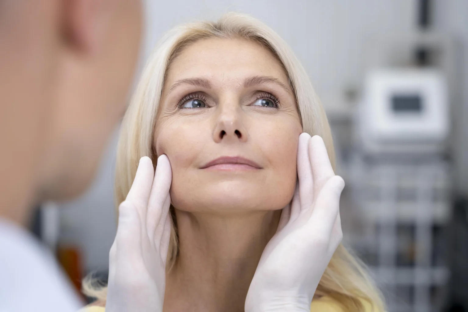 close-up-doctor-checking-smiley-woman-1
